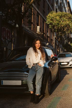 Cheerful young woman in street