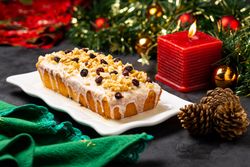 Fruit cake served among Christmas decorations