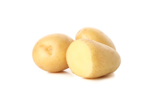 Whole and halved potato