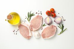 Composition with raw meat and ingredients on light background, top view