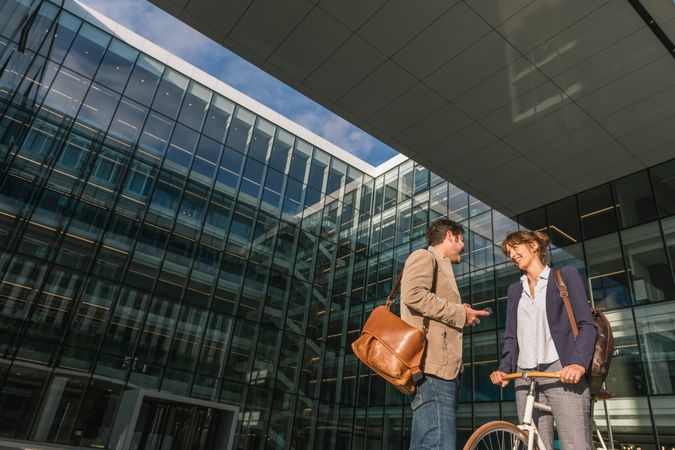Businesspeople talking on street after work