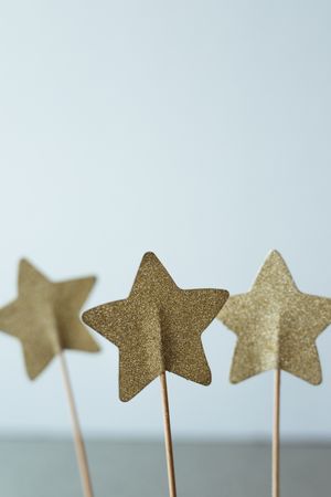 Cutout golden stars on stick for decoration