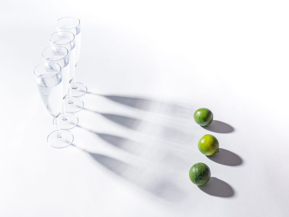 Creative composition of citrus and glasses of water