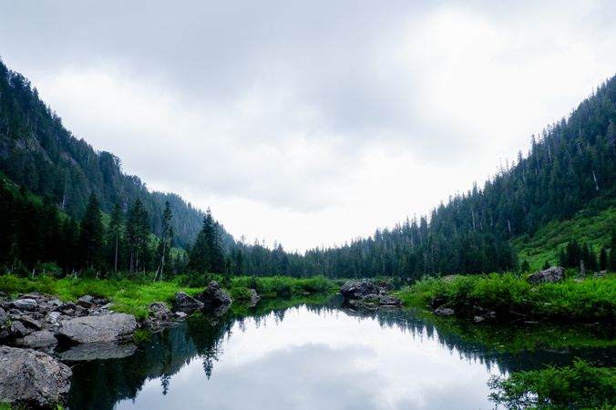 Green trees beside lake under blue sky near Granite Fall, Washington, US