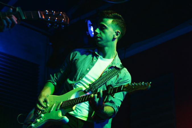 Rock Guitarist In Concert Hall Stage