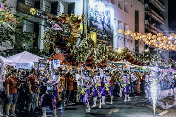 People performing the Dragon Dance at night during Chinese New Year in Bangkok, Thailand