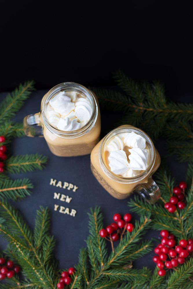 Christmas holiday background with hot cocoa marshmellou. The inscription Happy New Year.