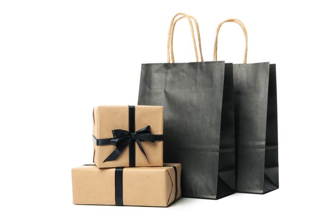 Gift boxes and paper bags isolated on plain background