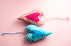 Pink pastel table with felt blue and pink heart ornaments