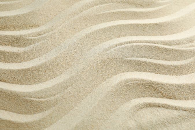 Seamless sand on a whole background, space for text. Summer vacation backdrop