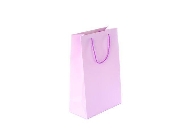 Purple paper bag isolated on blank background