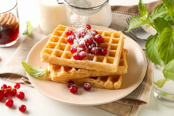 Beautiful composition with sweet waffles, closeup