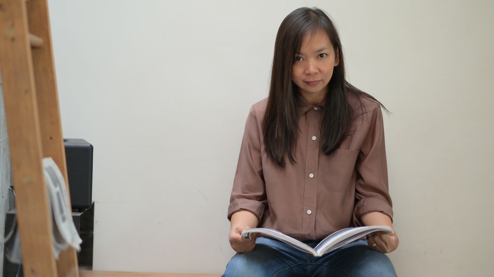 Woman sitting and reading