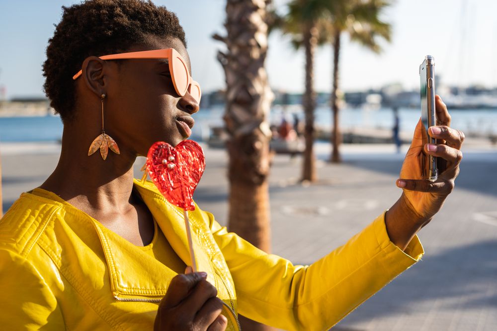 Black woman eating candy