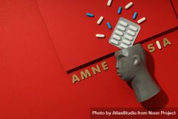 Bust with pills and the words “Amnesia” with space for text 5wWm95