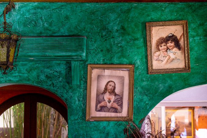 Sacred heart picture on green wall