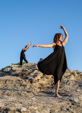 Women dancing near stones