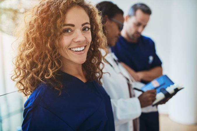 Woman in blue scrubs