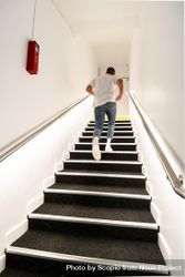 Man climbing stairs indoor 5zPBob