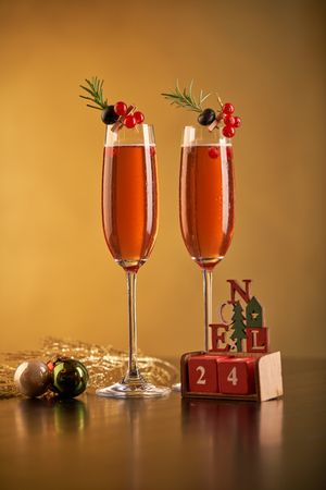 Champagne glasses near Christmas decorations