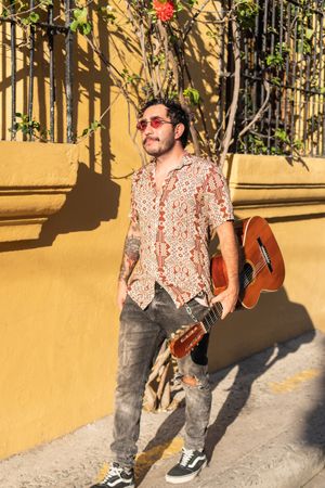 Latin Musician Walking In The Street