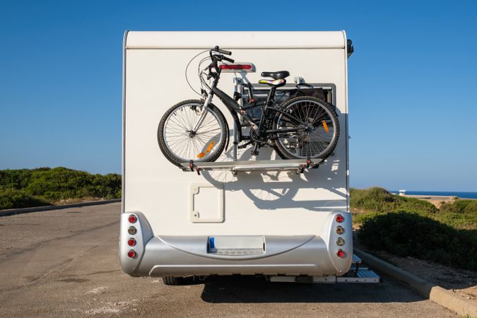 RV with bicycles on countryside road