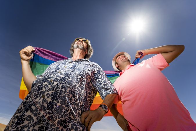 Excited gay couple in desert