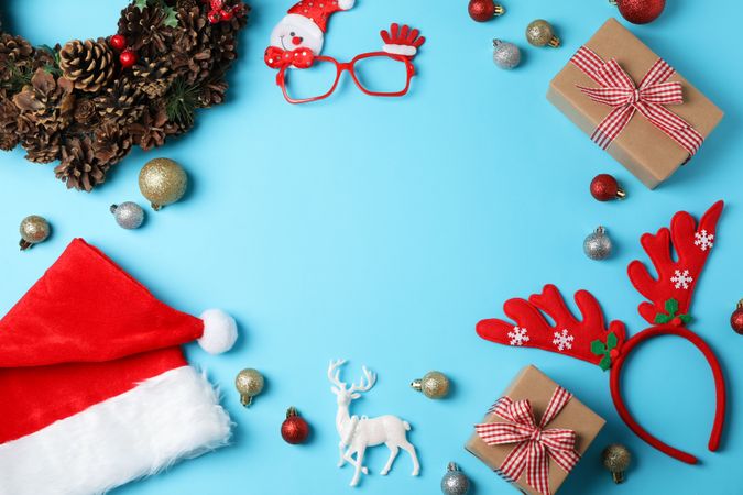 Composition with Christmas baubles on blue background, space for text