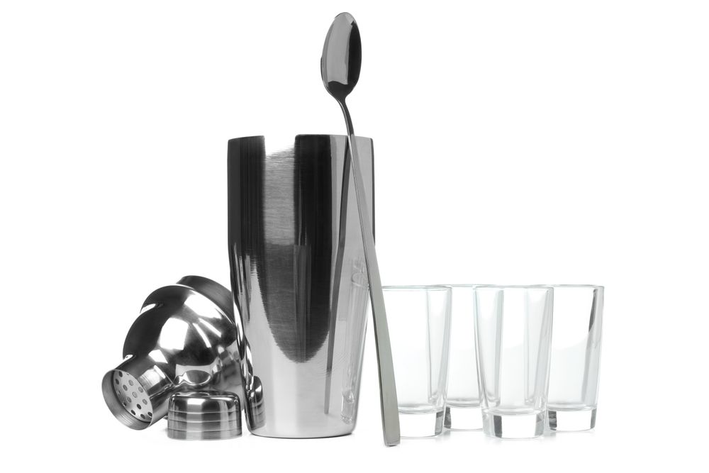 Concept of preparing alcohol drink or cocktail, shaker, isolated on plain background