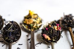 Close up of loose leaf tea in vintage spoons