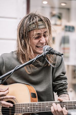 Male musician performing in the street