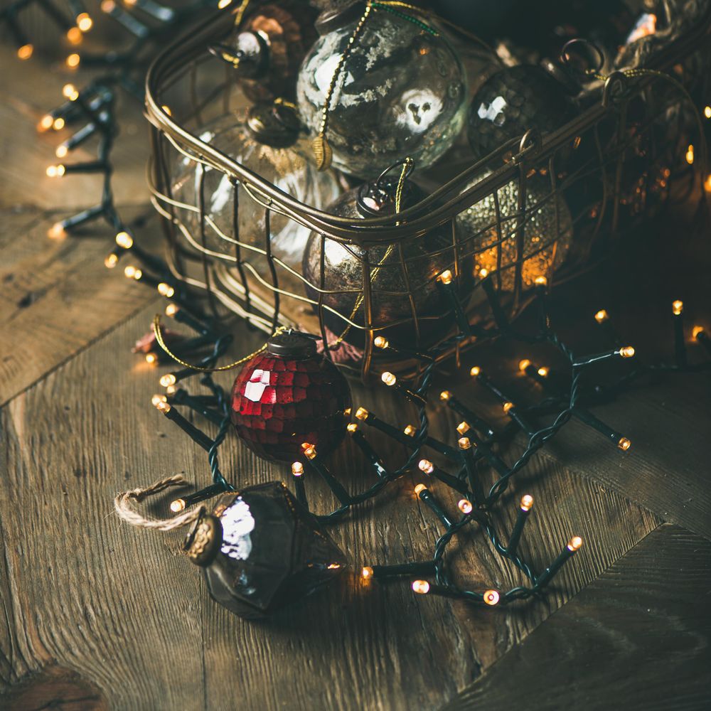 Christmas tree decorations in wire box, square crop