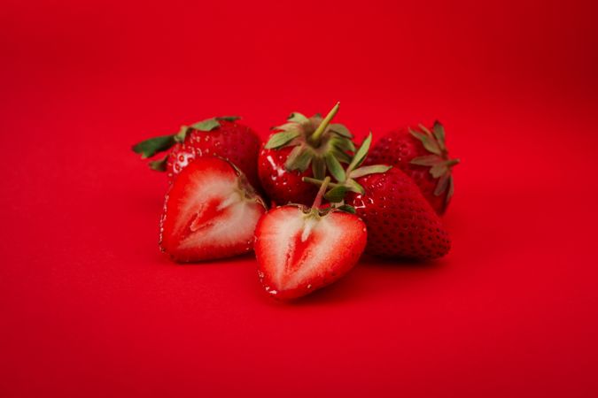 Tasty strawberry on red background. Summer berry