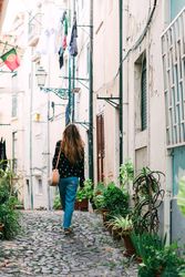 Woman strolling on old city street