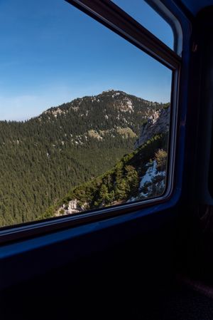 Cog railway window view with mountain peaks in the Bavarian Alps, Germany