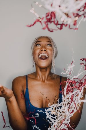 Excited Black female having fun with serpentine