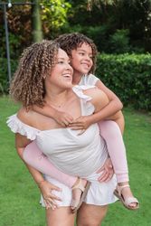 Mother having fun with her daughter at park