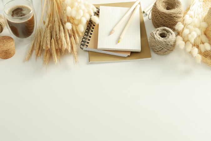 Looking down at table of arts and crafts supplies on table with copy space