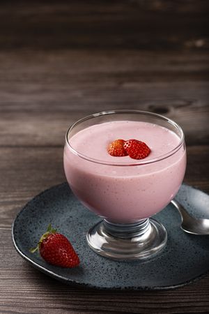 Delicious strawberry mousse in glass goblet.