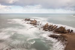 Wonderful ocean rocky coast in fair weather