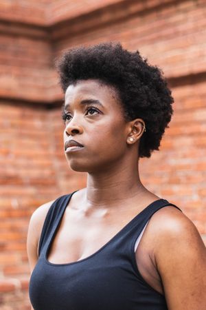 Sad Black woman with Afro hairstyle looking away