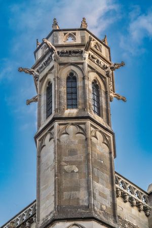 Tower of the church of Saint Nazaire in the historic fortification castle of Carcassonne. A tall building with a pointed top and a window on the top