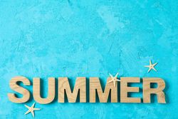 Inscription summer with starfishes on color background, space for text. Happy holidays