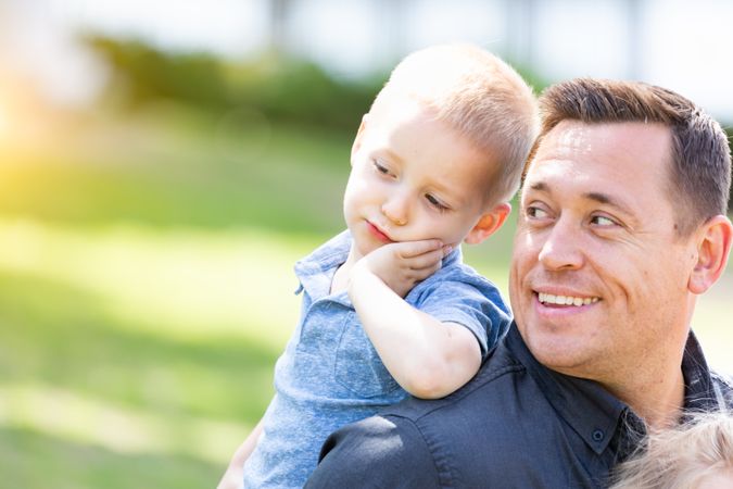 Father and Son Having Fun At The Park