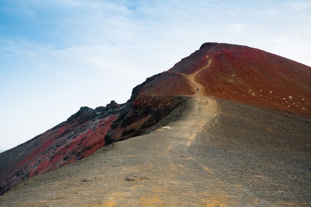 Man in the distance jogging up hill