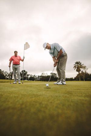 Two professional golfers playing golf together on golf course
