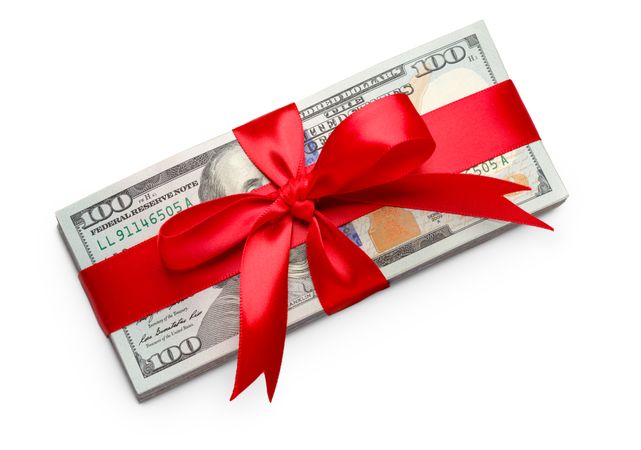 Stack of One Hundred Dollard Bills Wrapped in a Red Ribbon and Bow