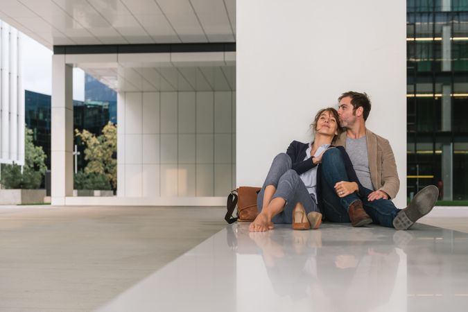 Businesspeople resting outside modern building
