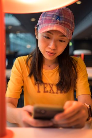 Asian woman browsing on smartphone