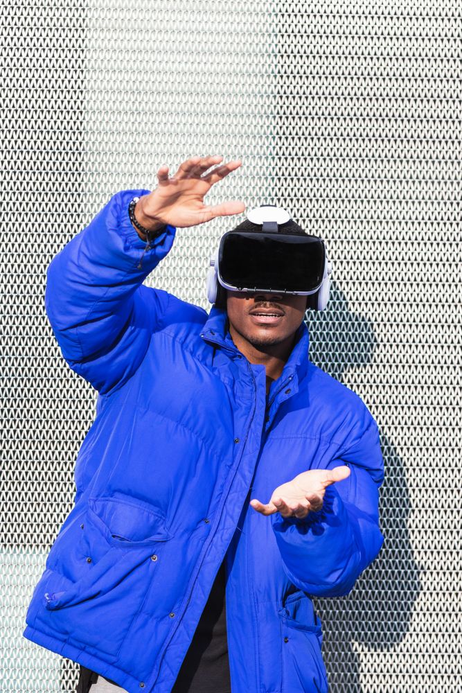 Black man experiencing virtual reality in city